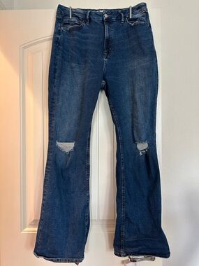 Forever 21 size 33 Women’s Dark Blue Distressed Flare Jeans